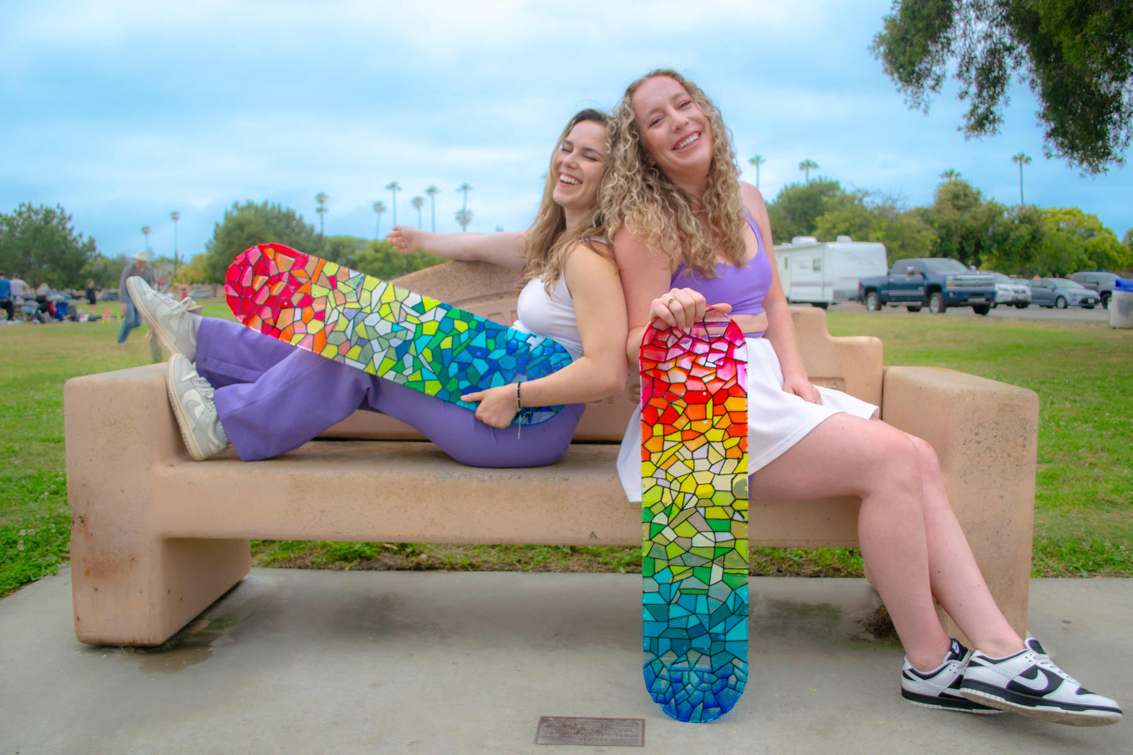 Two rainbow, see through resin stained glass skateboard decks. Unique wall art.